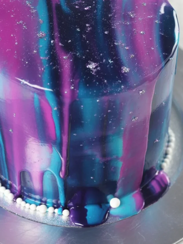 Colorful Galaxy Mirror Glaze Cake with a shiny, reflective surface, resembling outer space.