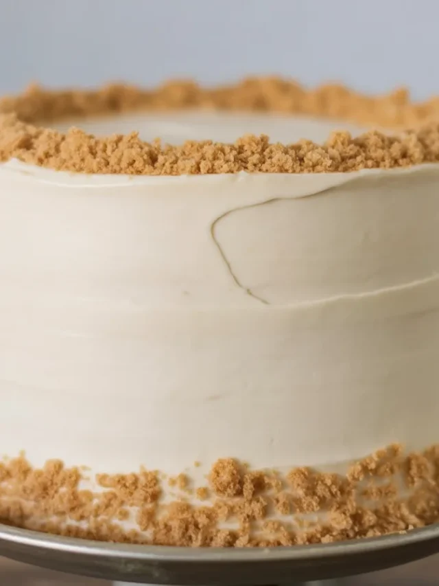 A beautifully decorated Thanksgiving cake featuring fall leaves and seasonal flavors.