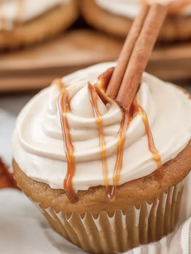 Moist apple cider cupcakes topped with spiced buttercream and fall decorations.