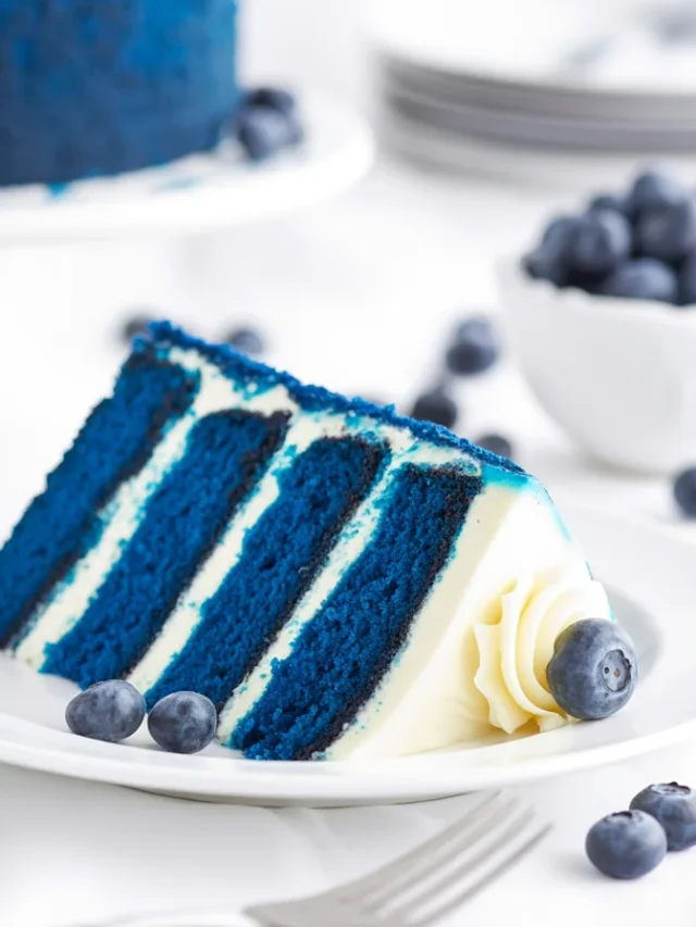 Delicious Blue Cake topped with cream cheese frosting for a festive occasion.