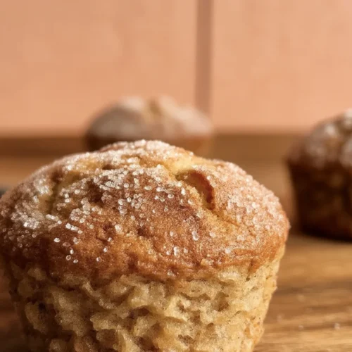 Apple Cider Donut Muffins 3 Delicious apple cider donut muffins coated in cinnamon sugar, perfect for fall.