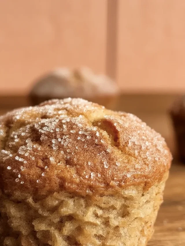 Delicious apple cider donut muffins coated in cinnamon sugar, perfect for fall.