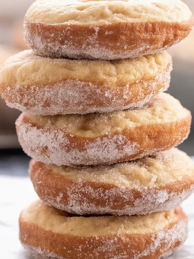 Delicious gluten free apple cider donuts coated in cinnamon sugar