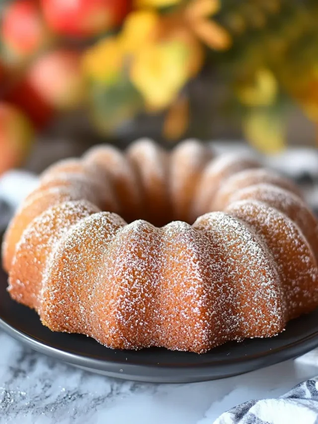 Delicious Apple Cider Doughnut Cake with a cinnamon-sugar topping and fresh apple flavor.