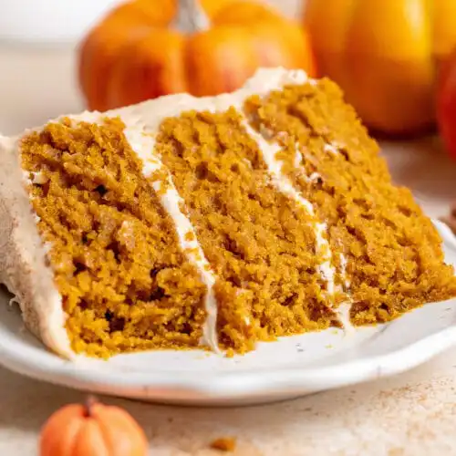 Gooey November Cake served with salted butter tea in a cozy café setting.