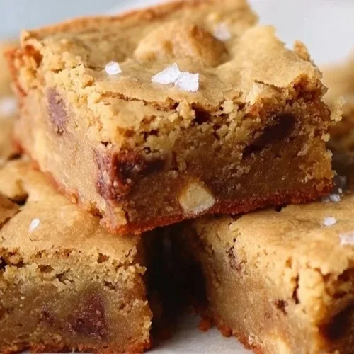 Delicious homemade blondies with a golden crust and chewy texture.