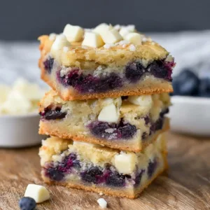 Blueberry White Chocolate Blondies 3 Blueberry white chocolate blondies fresh out of the oven, cut into squares.