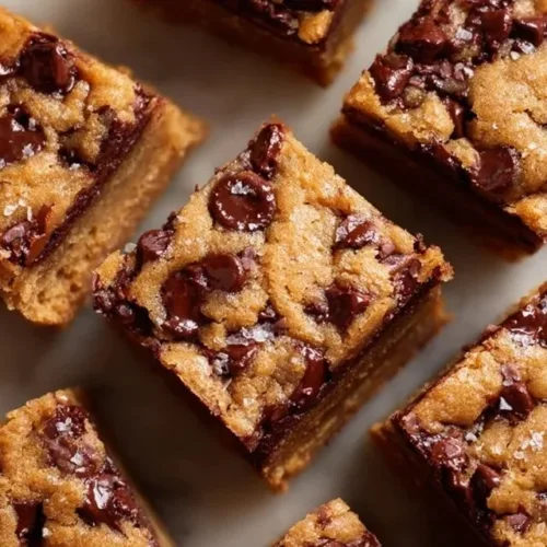 Freshly baked brown butter chocolate chip blondies with golden edges