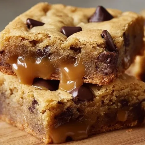 Chewy blondies fresh out of the oven, golden and delicious.