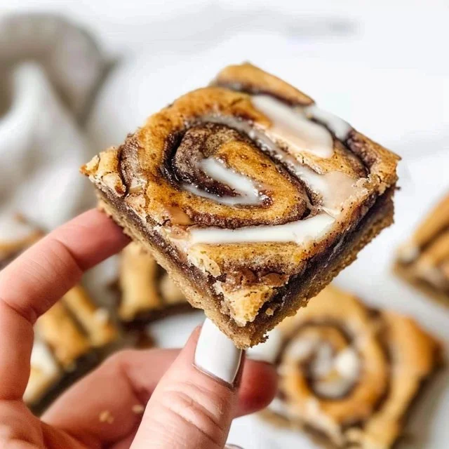 Deliciously easy cinnamon roll blondies topped with creamy frosting.