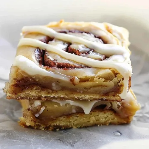 Easy cinnamon roll blondies drizzled with cream cheese glaze
