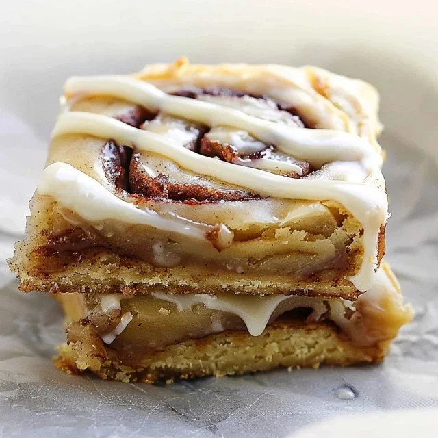 Easy cinnamon roll blondies drizzled with cream cheese glaze