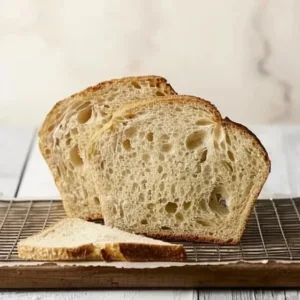 Easy Sourdough Sandwich Bread 3 Loaf of easy sourdough sandwich bread sliced on a wooden board