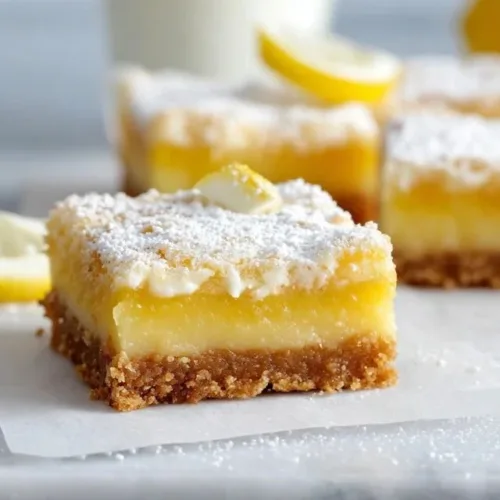 Delicious gluten free lemon bars with a tangy lemon topping on a crust.