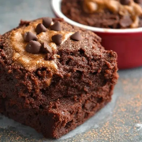 Delicious healthy protein brownie topped with nuts and chocolate drizzle