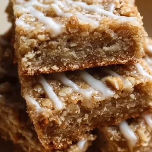 Delicious iced oatmeal cookie bars topped with creamy frosting