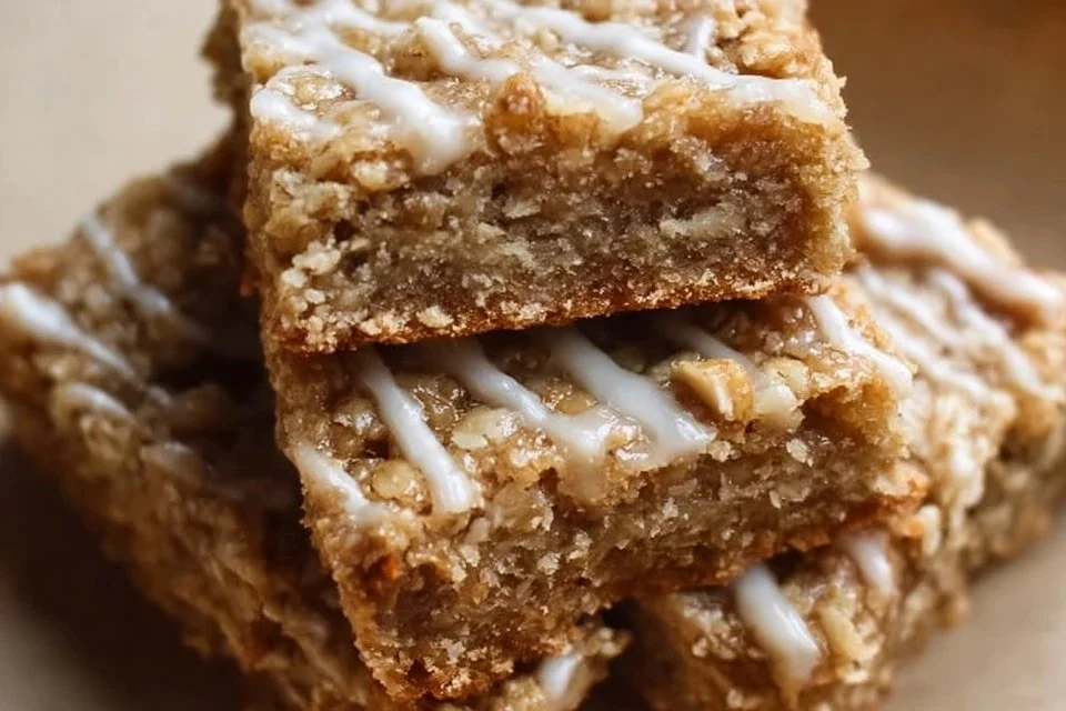 Delicious iced oatmeal cookie bars topped with creamy frosting