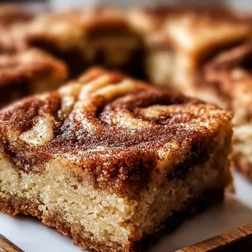 Irresistible cinnamon swirl blondies with snickerdoodle flavors.