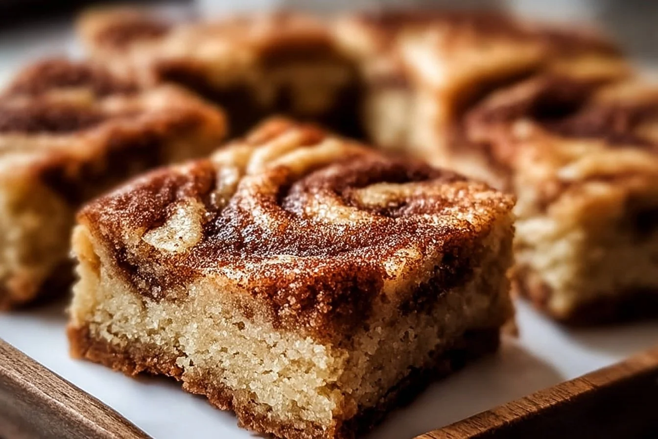 Irresistible cinnamon swirl blondies with snickerdoodle flavors.