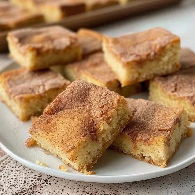 Delicious Snickerdoodle Blondies treat with cinnamon and buttery flavor.
