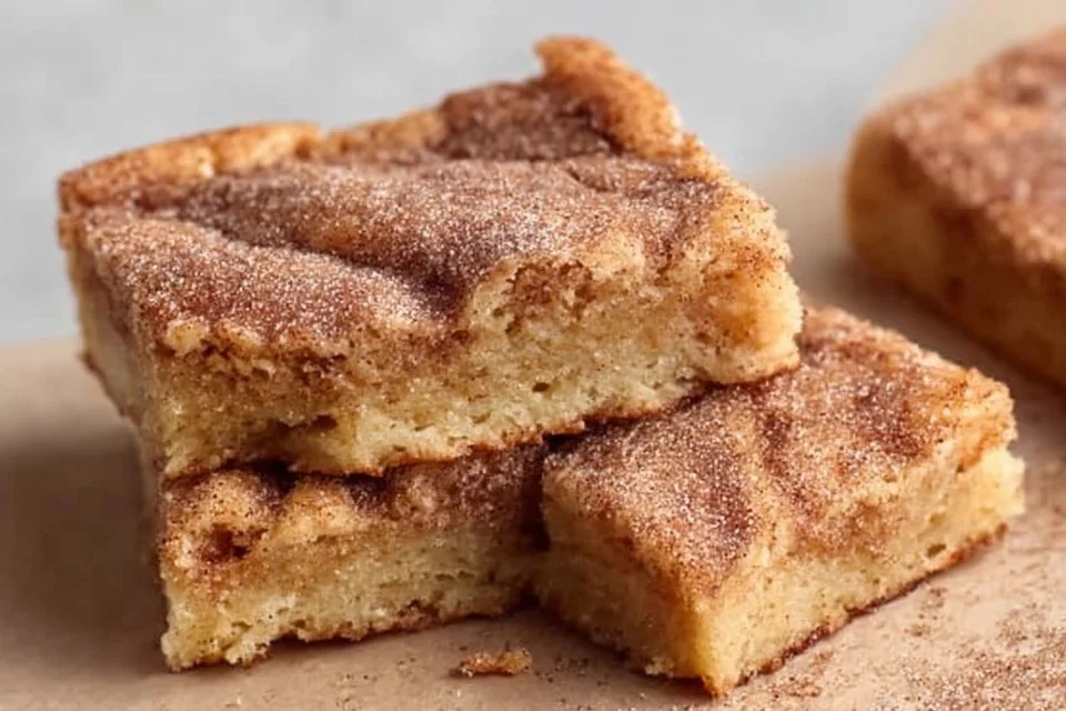 Plate of snickerdoodle blondies topped with cinnamon sugar