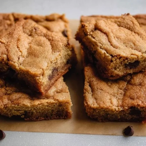 Freshly baked sourdough blondies in a pan, golden and delicious