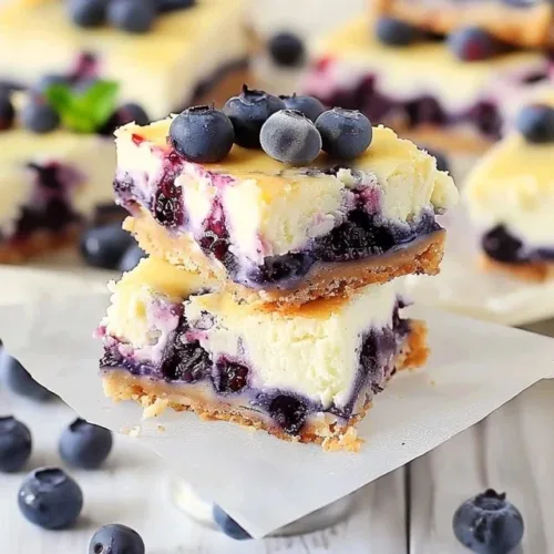Delicious blueberry cheesecake bars with a creamy texture and vibrant blueberry topping.