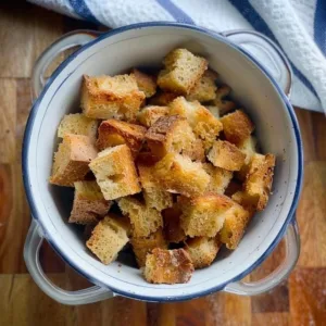 Homemade sourdough croutons in a bowl, ready for serving.