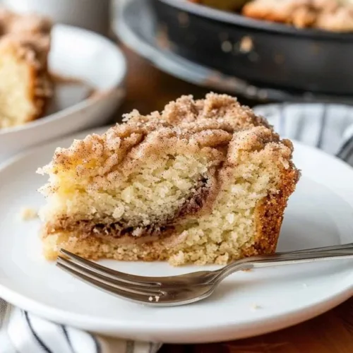 Delicious homemade cinnamon swirl coffee cake with a rich, aromatic swirl.