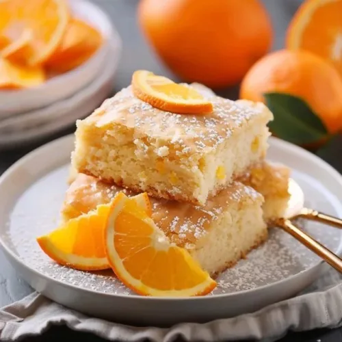 No bake chocolate dessert bars topped with chocolate drizzle and nuts