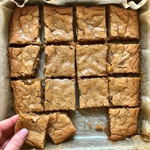 Freshly baked sourdough blondies with a golden-brown top and chewy texture.