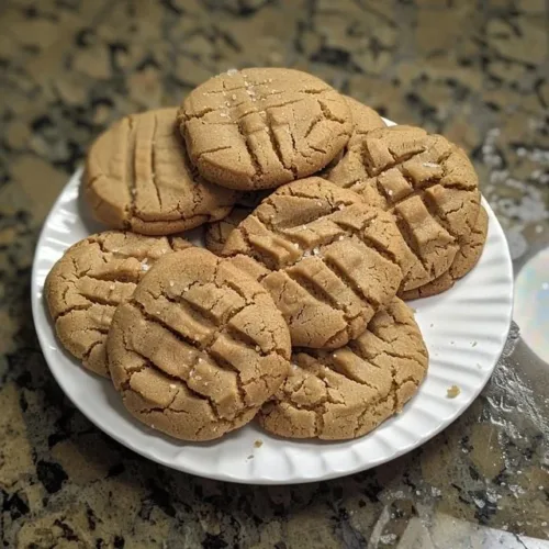 Freshly baked sourdough peanut butter cookies on a cooling rack