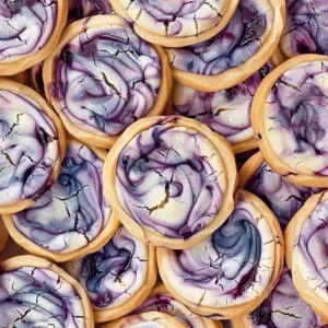 Blueberry cheesecake cookies freshly baked on a cooling rack
