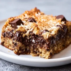 Decadent chocolate chip coconut blondies with a rich golden color
