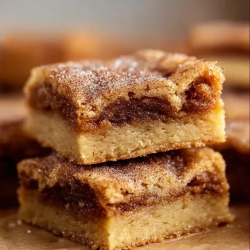 Freshly baked Cinnamon Sugar Blondies topped with a dusting of cinnamon sugar