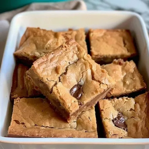 Delicious easy blondie brownies on a white plate