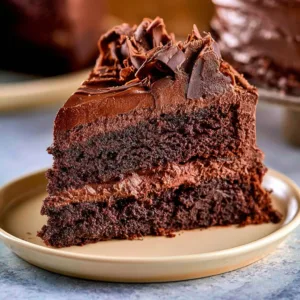 Delicious slice of healthy chocolate cake topped with fresh berries
