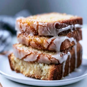 Slice of homemade apple cider pound cake with a drizzle of icing