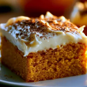 Delicious pumpkin bars with creamy cream cheese frosting on a plate