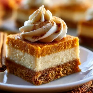Delicious pumpkin pie cheesecake bars topped with whipped cream and spices