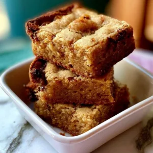 Soft and chewy blondie brownies on a plate, ready to be enjoyed.