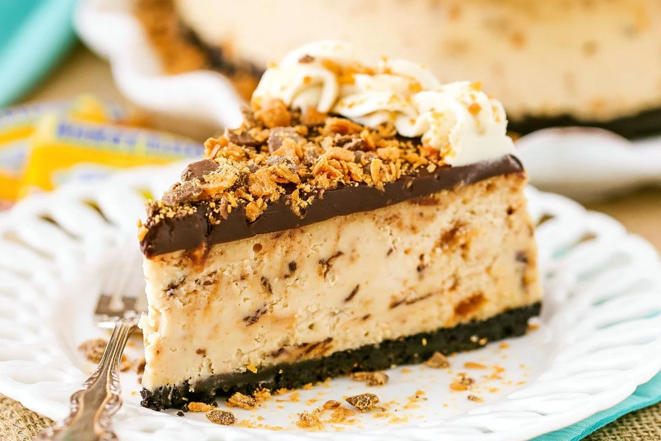 fun-butterfinger-cheesecake-idea-2026-10-01-160608 Delicious Butterfinger cheesecake topped with crushed Butterfinger candy
