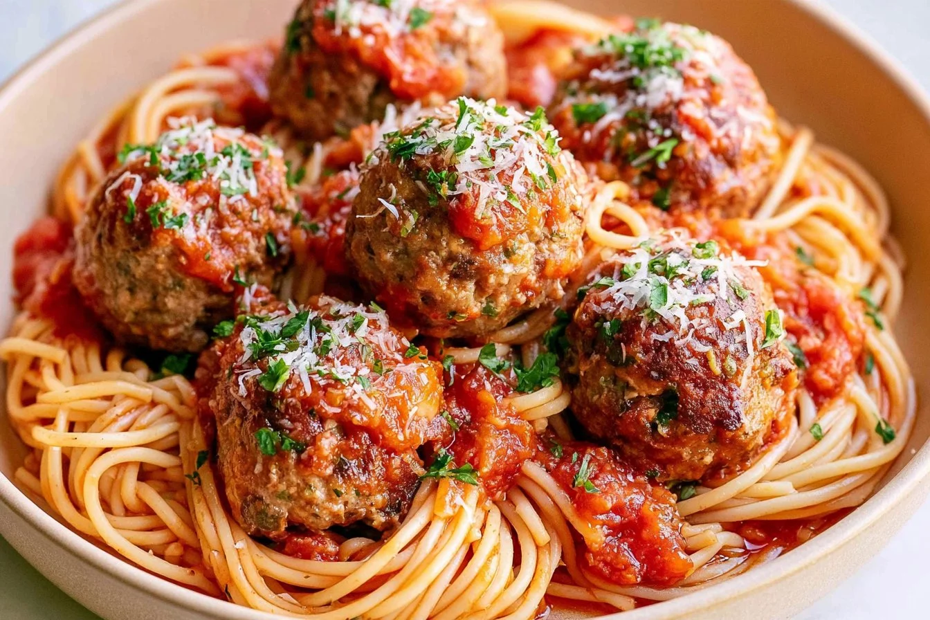 melt-in-your-mouth-italian-meatballs-2026-10-27-195057 Delicious melt-in-your-mouth Italian meatballs served with marinara sauce